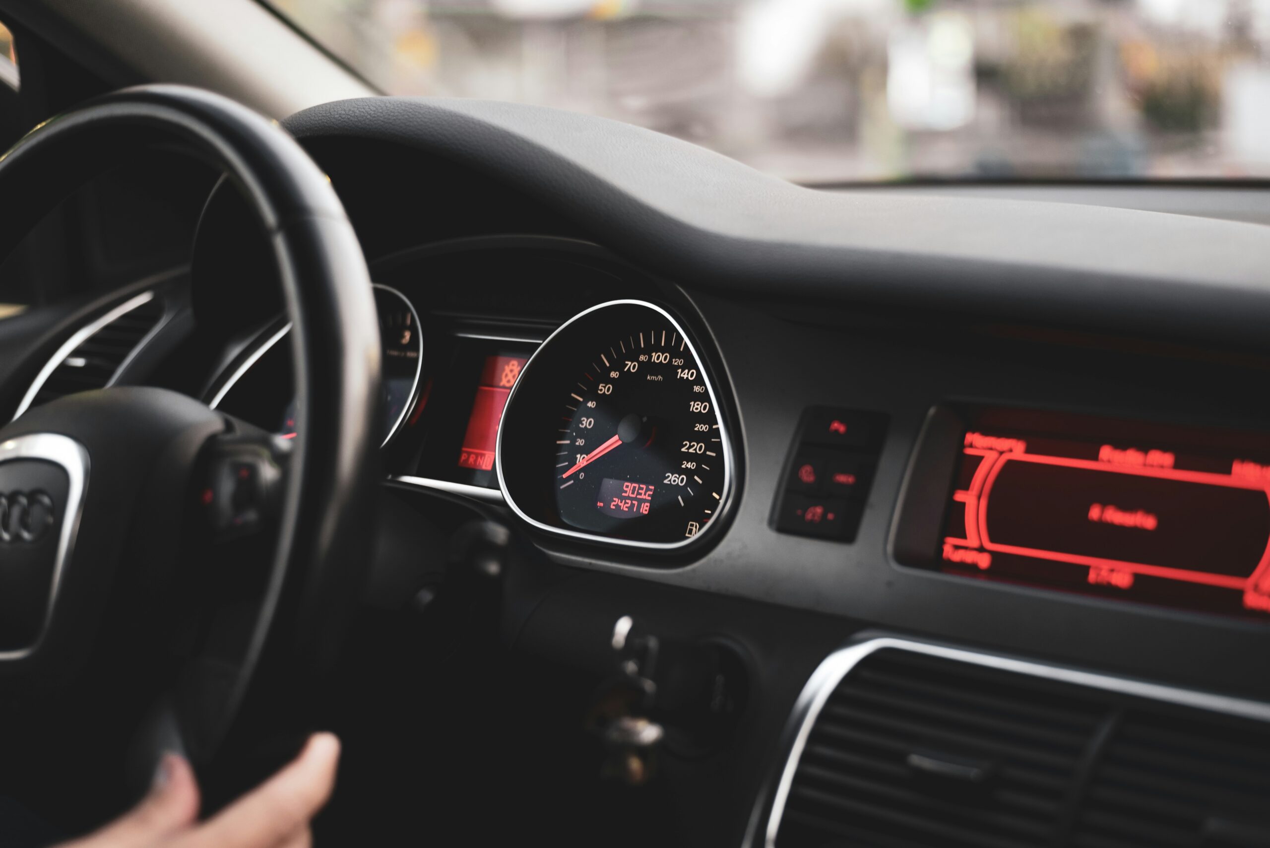Vehicle dashboard and steering wheel, illustrative banner photograph
